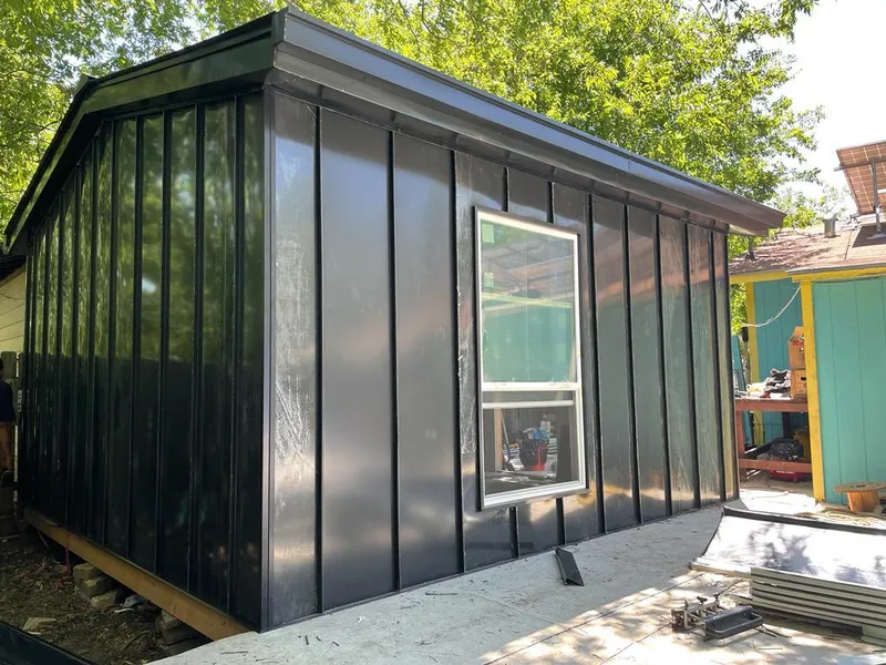 Black standing seam metal wall panels for Roof Inspection in Eudora